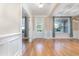 Bright living room with hardwood floors, wainscoting, and a front door view at 1549 Kensington Ln., Myrtle Beach, SC 29577