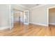 Open living space with hardwood floors, French doors, and neutral wall colors at 1549 Kensington Ln., Myrtle Beach, SC 29577