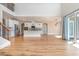 Open floor plan featuring hardwood floors, kitchen island, and natural light at 1549 Kensington Ln., Myrtle Beach, SC 29577