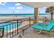 Balcony offers a panoramic ocean view with lounge chairs for ultimate relaxation at 1620 N Waccamaw Dr. # 103, Garden City Beach, SC 29576