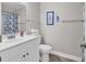 Well-lit bathroom features a single sink vanity, toilet, and decorative accents at 1620 N Waccamaw Dr. # 103, Garden City Beach, SC 29576