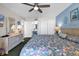 Bedroom features a ceiling fan, closet and ensuite bathroom with a large vanity at 1620 N Waccamaw Dr. # 103, Garden City Beach, SC 29576