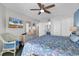Inviting bedroom features a ceiling fan and access to the en suite bathroom at 1620 N Waccamaw Dr. # 103, Garden City Beach, SC 29576