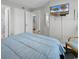 Cozy bedroom featuring a comfortable bed, closet, and a wall-mounted TV for relaxation and convenience at 1620 N Waccamaw Dr. # 103, Garden City Beach, SC 29576