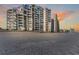 Stunning oceanfront condo building with private balconies overlooking the sandy beach and sparkling ocean at 1620 N Waccamaw Dr. # 103, Garden City Beach, SC 29576
