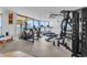 Well-equipped gym featuring ocean views, treadmills, elliptical machines, and weight training equipment at 1620 N Waccamaw Dr. # 103, Garden City Beach, SC 29576