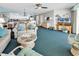 Comfortable living room featuring cozy couches and a glimpse of the kitchen at 1620 N Waccamaw Dr. # 103, Garden City Beach, SC 29576