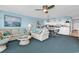 Open floor plan with living room, dining area, and kitchen with bar seating at 1620 N Waccamaw Dr. # 103, Garden City Beach, SC 29576