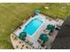 Aerial shot showcasing the pool area, deck, and manicured lawn of this home at 1763 Hemingway Rd., Loris, SC 29569