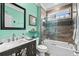 Bright bathroom features a tub and shower combo with glass doors and custom tile work at 1763 Hemingway Rd., Loris, SC 29569