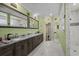 Bathroom with double sinks, marble floors, and a large shower at 1763 Hemingway Rd., Loris, SC 29569