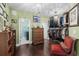 Spacious walk-in closet with wood floors, custom shelving, and elegant lighting fixtures at 1763 Hemingway Rd., Loris, SC 29569