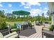 Spacious outdoor deck perfect for entertaining, overlooking the pool and backyard area at 1763 Hemingway Rd., Loris, SC 29569