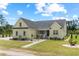 Charming yellow home with a well-manicured lawn and beautiful landscaping creates instant curb appeal at 1763 Hemingway Rd., Loris, SC 29569