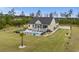 Aerial view of a beautiful home with a pool, deck, and landscaped yard at 1763 Hemingway Rd., Loris, SC 29569