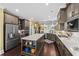 Open kitchen layout with stainless steel appliances, marble countertops and center island at 1763 Hemingway Rd., Loris, SC 29569