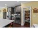 Spacious kitchen featuring stainless steel appliances and an adjacent pantry for ample storage at 1763 Hemingway Rd., Loris, SC 29569