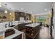 Modern kitchen with large island, stainless steel appliances, and eat-in dining area at 1763 Hemingway Rd., Loris, SC 29569