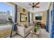 Cozy living room with neutral tones, comfortable seating, a ceiling fan, and natural light at 1763 Hemingway Rd., Loris, SC 29569