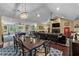 Expansive living space offering a dining area, a pool table, and comfortable leather seating at 1763 Hemingway Rd., Loris, SC 29569