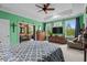 Inviting main bedroom featuring large windows, natural light, and comfortable furnishings at 1763 Hemingway Rd., Loris, SC 29569