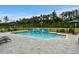 In-ground pool with a patio, waterfall feature, and comfortable seating. Perfect for outdoor enjoyment at 1763 Hemingway Rd., Loris, SC 29569