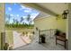 Inviting porch with charming details and lush landscaping, offering a peaceful outdoor space at 1763 Hemingway Rd., Loris, SC 29569