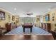 Game room with a pool table, hardwood floors, and natural light from the windows at 1763 Hemingway Rd., Loris, SC 29569