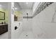 Modern shower with white marble tile, a sleek black showerhead, and a glass door at 1763 Hemingway Rd., Loris, SC 29569