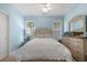 Comfortable blue bedroom with natural light, ceiling fan and a relaxing atmosphere at 190 Barony Pl., Pawleys Island, SC 29585