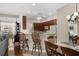 Open-concept view of the dining room, breakfast bar, and living room with neutral paint tones at 190 Barony Pl., Pawleys Island, SC 29585