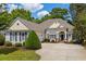 Charming single-story home with beige siding, mature landscaping, and a spacious concrete driveway at 190 Barony Pl., Pawleys Island, SC 29585