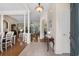 Inviting foyer featuring tile flooring, columns, and archways leading to the dining and living areas at 190 Barony Pl., Pawleys Island, SC 29585