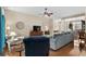 Inviting living room showcasing hardwood floors, a cozy armchair, and open access to other living areas at 190 Barony Pl., Pawleys Island, SC 29585