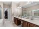 This main bathroom features a dual sink vanity with lots of counter space and a shower at 190 Barony Pl., Pawleys Island, SC 29585