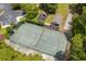 Aerial view of community tennis court and amenities, with recreational opportunities amidst lush greenery at 190 Barony Pl., Pawleys Island, SC 29585
