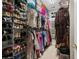 Spacious walk-in closet with custom shelving, shoe racks, and ample storage for clothes at 190 Barony Pl., Pawleys Island, SC 29585