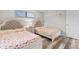 Cozy bedroom with two stylish beds, accent wall, and wood-look floors at 2000 Greens Blvd. # 40C, Myrtle Beach, SC 29577