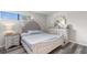 Charming bedroom with tufted headboard, wood floors and matching dresser at 2000 Greens Blvd. # 40C, Myrtle Beach, SC 29577
