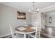 Dining area featuring a round table with seating for four and stylish coastal-themed decor at 2000 Greens Blvd. # 40C, Myrtle Beach, SC 29577