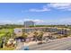 Overhead aerial view of resort buildings with palm trees, pool, parking, and surrounding green spaces at 201 Ocean Blvd. S # 1505, North Myrtle Beach, SC 29582