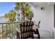 Spacious balcony with seating area, views of palm trees and nearby buildings at 201 Ocean Blvd. S # 1505, North Myrtle Beach, SC 29582