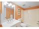 Bright bathroom featuring a single sink vanity, toilet and tub with a shower at 201 Ocean Blvd. S # 1505, North Myrtle Beach, SC 29582