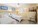 Comfortable bedroom with two beds, neutral decor, and ample lighting at 201 Ocean Blvd. S # 1505, North Myrtle Beach, SC 29582