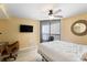 Bright bedroom with large windows, modern furniture, and a view to the balcony at 201 Ocean Blvd. S # 1505, North Myrtle Beach, SC 29582