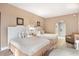 Comfortable bedroom with two beds, neutral decor and updated lighting at 201 Ocean Blvd. S # 1505, North Myrtle Beach, SC 29582