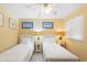 Cozy bedroom featuring two twin beds, decorative artwork, and bedside tables at 201 Ocean Blvd. S # 1505, North Myrtle Beach, SC 29582