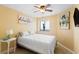 Cozy bedroom featuring a comfortable bed, ceiling fan and simple decor at 201 Ocean Blvd. S # 1505, North Myrtle Beach, SC 29582