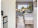 Bright bedroom featuring two beds and a balcony with a view of lush greenery at 201 Ocean Blvd. S # 1505, North Myrtle Beach, SC 29582