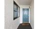 Entrance of condo featuring door 1505, a window, and a welcome mat providing a warm invitation at 201 Ocean Blvd. S # 1505, North Myrtle Beach, SC 29582